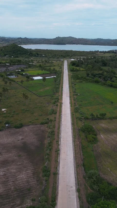 Highangle Shot Capturing Vehicle Movement On Vibrant Coast Road Stock Footage 328217306
