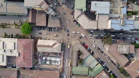 Highangle view of a vibrant city intersection with buildings and moving vehicles Stock Footage 317933584