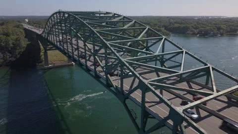 Higher flying north alongside Piscatqua River Bridge between Maine and New Hamps Stock Footage 345458766