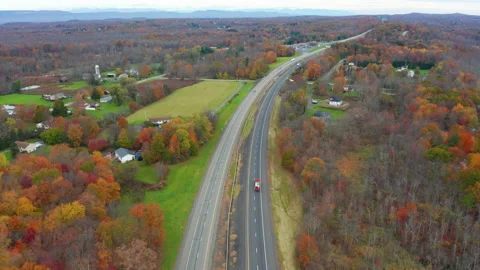Higher flying over route 87 in upstate New York in autumn Vídeo Stock 164353069
