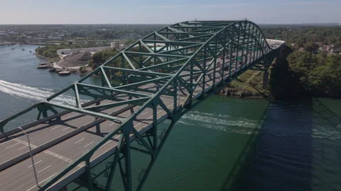 Higher flying south alongside Piscatqua River Bridge between Maine and New Hamps Stock Footage 345458460