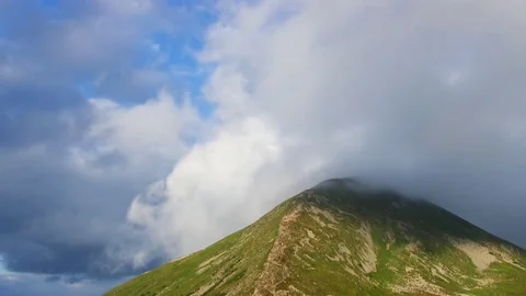 Highest mountain peak covered clouds. Stock Footage 82763509