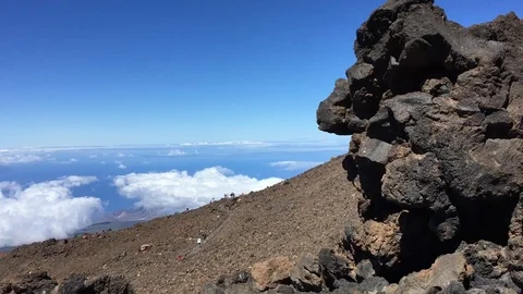 The highest peak of the teide covered by clouds and the blue sky Stock Footage 121144490