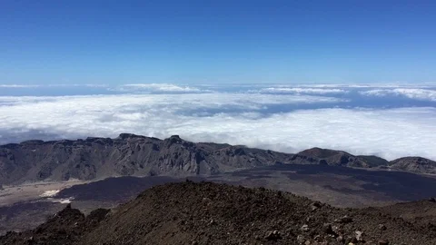The highest peak of the teide covered by clouds and the blue sky Stock Footage 121145016