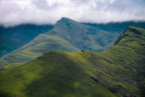 The highest peaks of the Courel range brush the belly of a layer of clouds Stock Photos