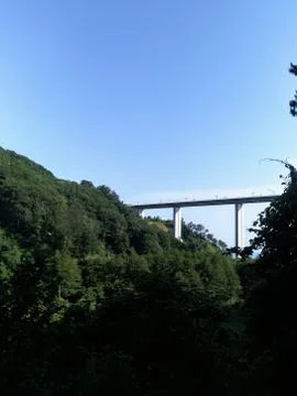 The highest viaduct bridge over a deep gorge in the mountains Stock Photos