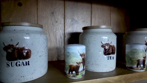 Highland Cow Ceramic Tea Coffee Sugar Canisters Set on Rustic Wooden Kitchen Stock Footage 333362504