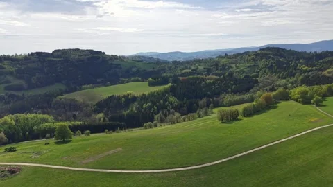 Highland Panorama Rolling Hills Patchwork Fields Winding Road Through Lush Stock Footage 346262990
