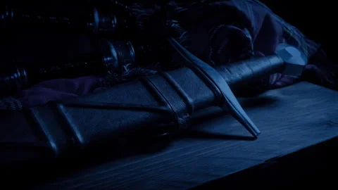 Highlander Picks Up Sword Or Puts It Down Near Bagpipes Stock Footage 280939572