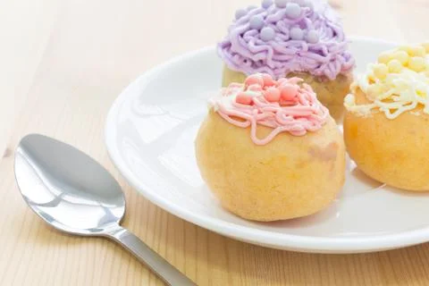 Highlight at Red Choux or Profiterole or Eclair in White Dish and Spoon Photos