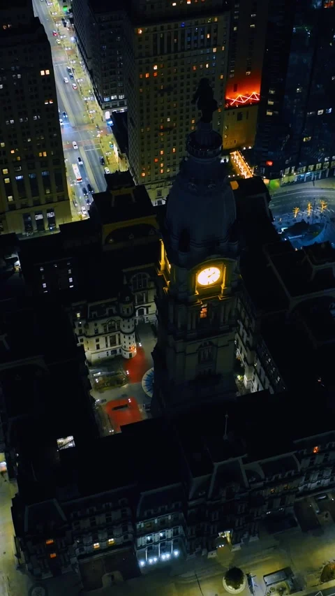 Highlighted building from outside and inside with a clock tower. Aerial view on Stock Footage 328928142