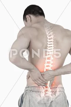 Highlighted spine of man with back pain Stock Photos