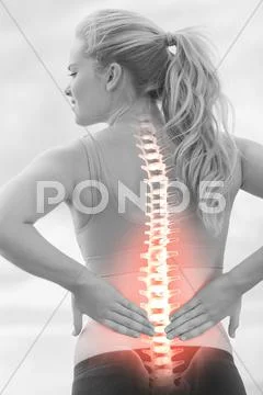 Highlighted spine of woman with back pain Stock Photos