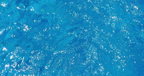 Highlighted Sun Light On Silvery Blue Water Stock-Footage 137835614