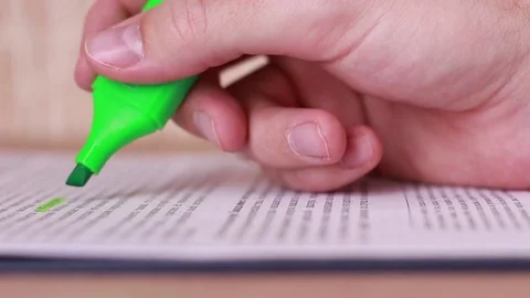 Highlighting article with green marker closeup Stock Footage 85167402