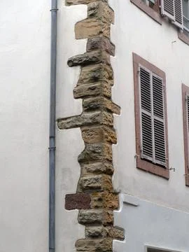 Highlighting chain-rustication on a building corner, contrasting with a smo.. Stock Photos