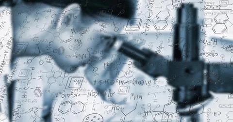 Highlighting compound microscope projecting chemical diagrams at lab bench, with Stock Photos