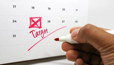 Highlighting a crucial target date on a calendar with a red marker, symboli.. Stock Photos