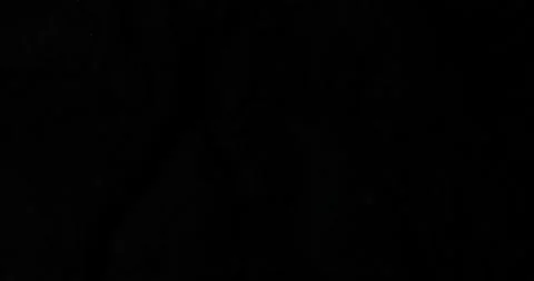 Highlighting Dark Textured Rock Surface with Cracks Stock Footage 296158537