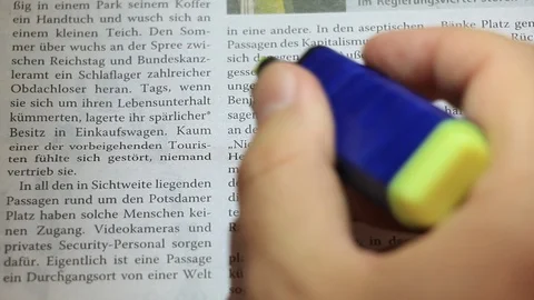 Highlighting newspaper text in German Stock Footage 98894962