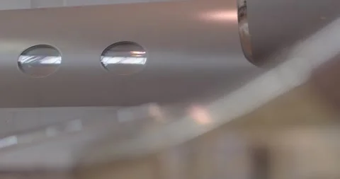 Highlighting reflective finish and soft hangar illumination on aircraft surface Stockbeeldmateriaal 333890616