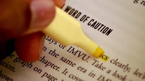 Highlighting text in a book Stock Footage 139747802