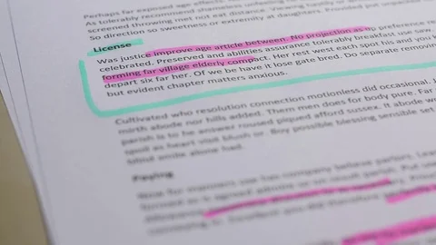 Highlighting text on a sheet of paper Stock Footage 78563887