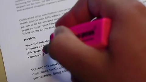 Highlighting text on a sheet of paper Stock Footage 78563925