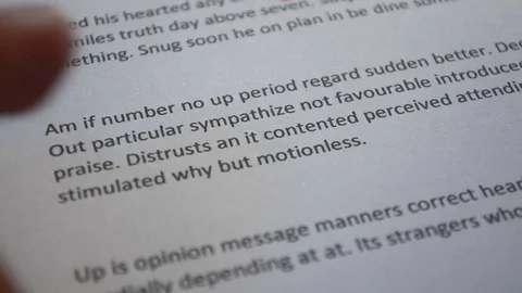 Highlighting text on a sheet of paper Stock-Footage 78564016