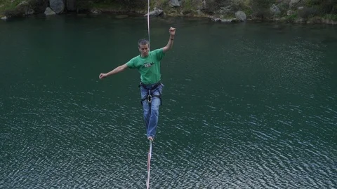 Highline walker over a lake Stock Footage 125426210