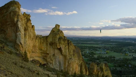 Highlining at Dusk - Smith Rock - 4k Stock Footage 106364007