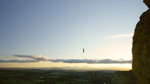 Highlining at Dusk - Smith Rock - 4k Stock Footage 106364118