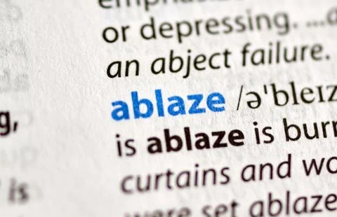 Highlited word in a dictionary Stock Photos