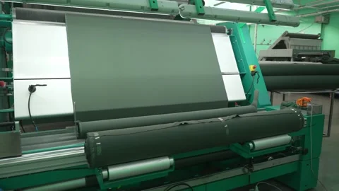Highly efficient textile rolling machine in operation. Concept of textile Stock Footage 277913992