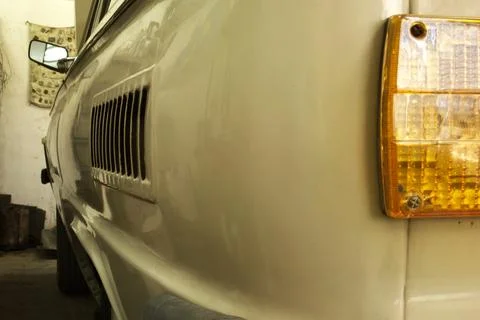 Highly rounded left rear corner of the vintage car. rear left lamp and side.. Stock Photos