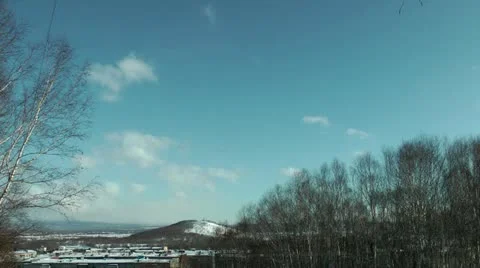 Highly in the sky over the snow-covered city the helicopter flies Stock-Footage 12314605