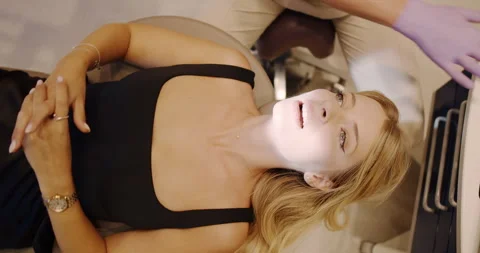 A highly specialized session focused on professional aesthetic treatment for Stock Footage 318442682