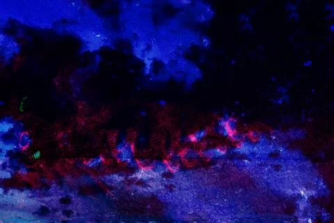 Highly stylized UV-reactive image of a painted or printed surface under blacklig Stock Photos