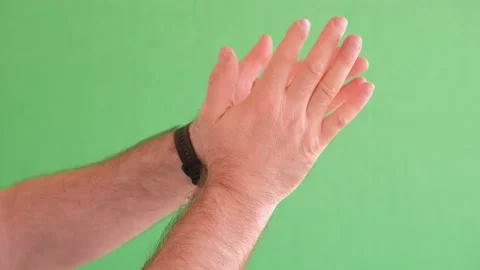 A highquality media content featuring hands clapping on a vibrant green Stock Footage 278577566