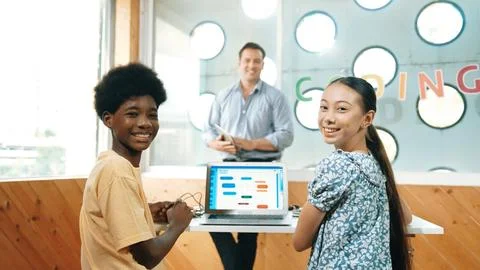 Highschool student study programing system while looking at camera. Edification. Fotos de archivo