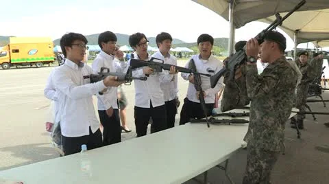 Highschool students learning how to shot with a rifle Stock Footage 12202522