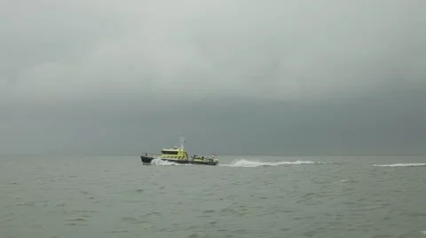 Highspeed ship transfer overtaking a coast guard boat Stock Footage 65821207