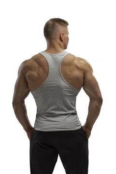 Hight-level bodybuilder posing in tank-top in white background Stock Photos