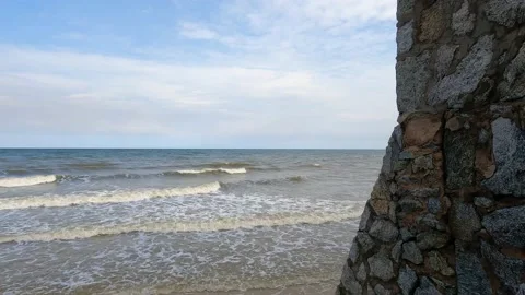 Hight stone wall for protect against sea wave and water levels Stock Footage 221214243
