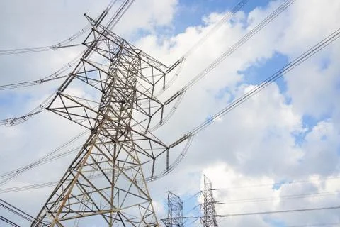 Hight voltage tower line on the cloudy sky background. Stock Photos