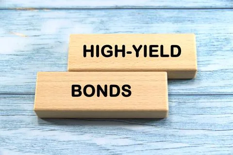 Hight-yield bonds wording  or text on wood block with blue background.Copy .. Stock Photos
