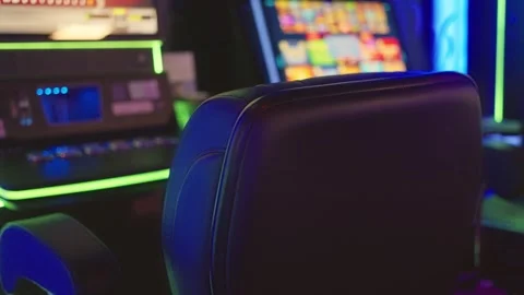 HighTech Casino Slot Machine Setup with Vibrant and Colorful Lights for Maximum Stock Footage 317510599