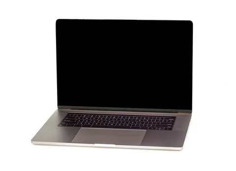 Hightech flat silver luxury notebook computer with lid open is display in i.. Stock Photos