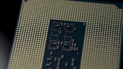 Hightech microprocessor bottom surface with gold pads and miniature capacitors Stock Footage 345605613