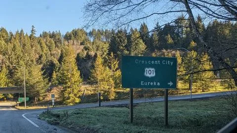 Highway 101 directional sign points toward Crescent City and Eureka Stock Photos